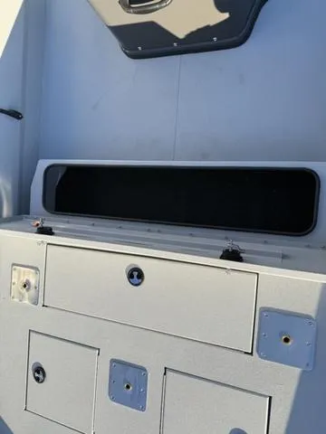 Slide: The Image of 2025 Avid 20 ROGUE CC boat storage compartments and seating area. - 10