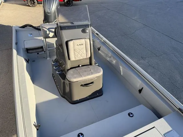 Slide: The Image of 2025 Avid 20 ROGUE CC boat interior with central console and seating. - 11