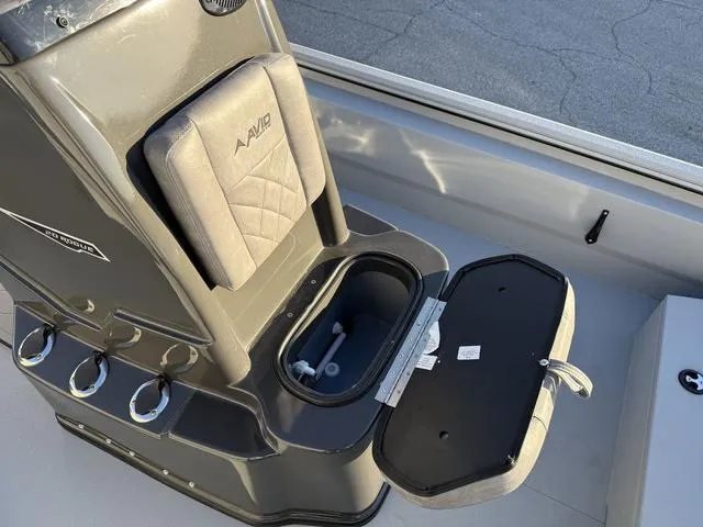 Slide: The Image of 2025 Avid 20 ROGUE CC boat seat with storage compartment open. - 12