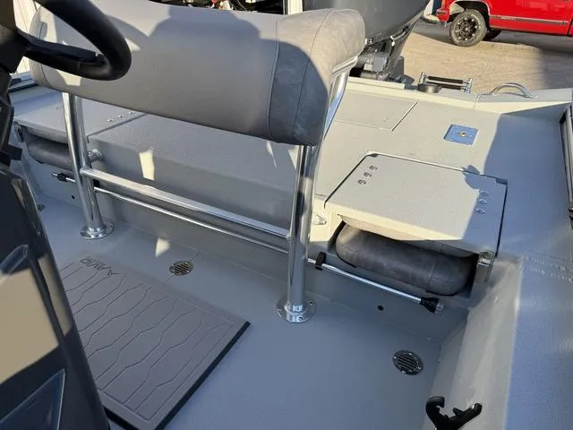 Slide: The Image of Interior of 2025 Avid 20 ROGUE CC boat with seating and storage compartments. - 16