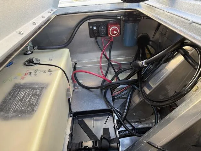 Slide: The Image of Interior view of 2025 Avid 20 ROGUE CC boat showing wiring and components. - 22