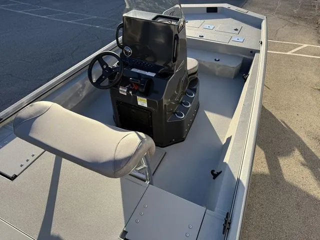 Slide: The Image of 2025 Avid 20 ROGUE CC boat interior with steering console and seating. - 24