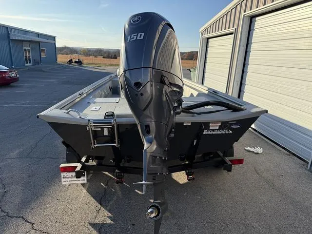 Slide: The Image of 2025 Avid 20 ROGUE CC boat with 150 HP engine in parking lot. - 5