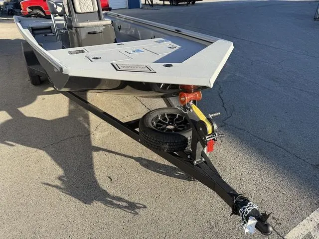 Slide: The Image of 2025 Avid 20 ROGUE CC boat on trailer, parked on pavement. - 6