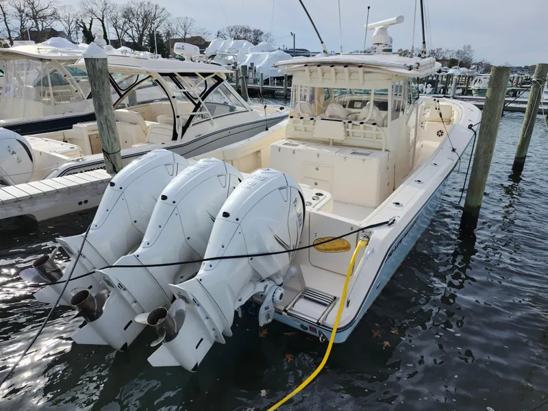 Slide: The Image of 2023 Grady-White Canyon 376 helm with advanced navigation displays and controls. - 15