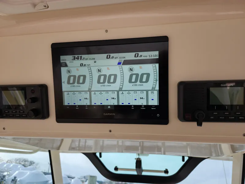 Slide: The Image of 2023 Grady-White Canyon 376 boat interior with luxurious seating and helm. - 21