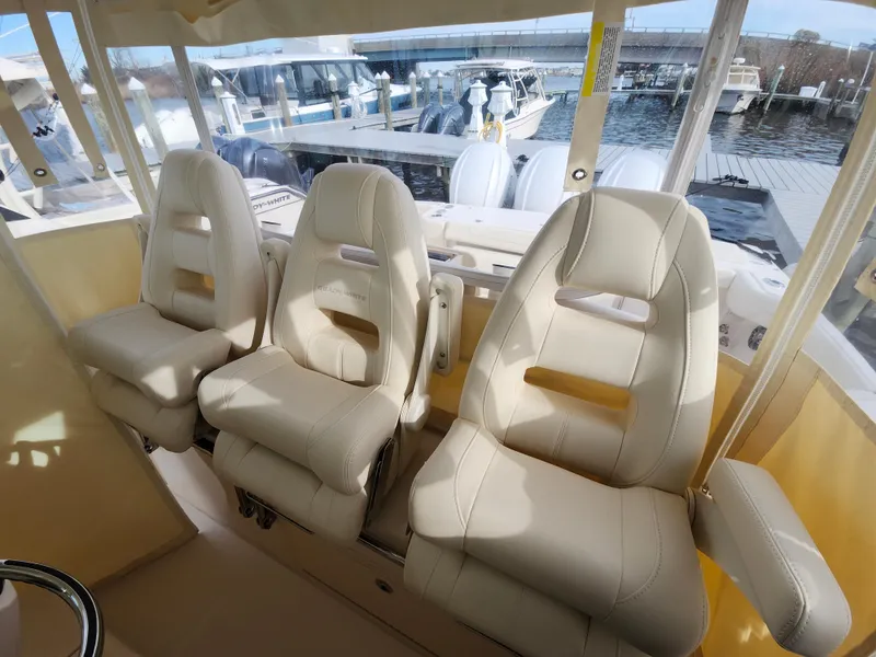 Slide: The Image of Control panel of 2023 Grady-White Canyon 376 boat with switches and joystick. - 24