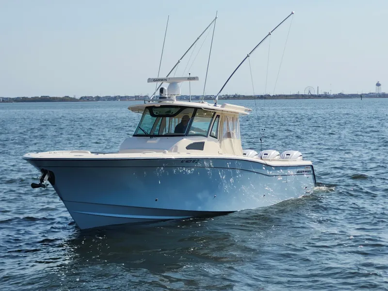 Slide: The Image of 2023 Grady-White Canyon 376 boat on open water, side view. - 3