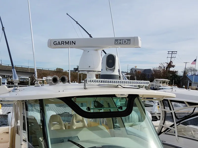 Slide: The Image of 2023 Grady-White Canyon 376 cabin interior with control panel and microwave. - 36