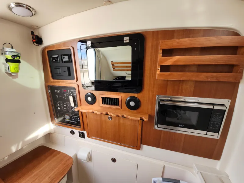 Slide: The Image of Control panel of 2023 Grady-White Canyon 376 with Dometic and Fusion systems. - 38