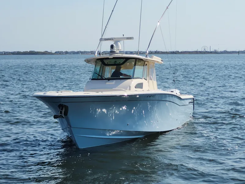 Slide: The Image of 2023 Grady-White Canyon 376 boat with triple engines on the water. - 4