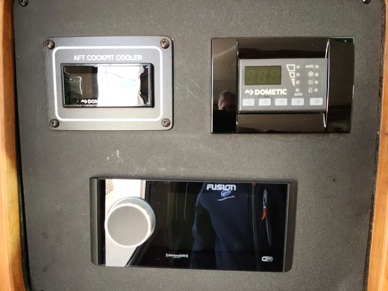 Slide: The Image of 2023 Grady-White Canyon 376 with triple Yamaha outboard engines docked at marina. - 40