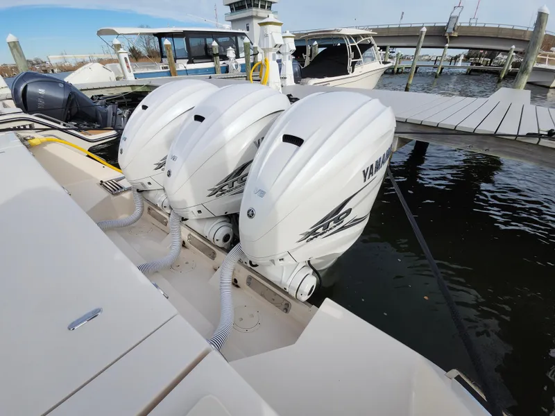 Slide: The Image of Yamaha display on 2023 Grady-White Canyon 376 showing fuel usage and trip distance. - 42