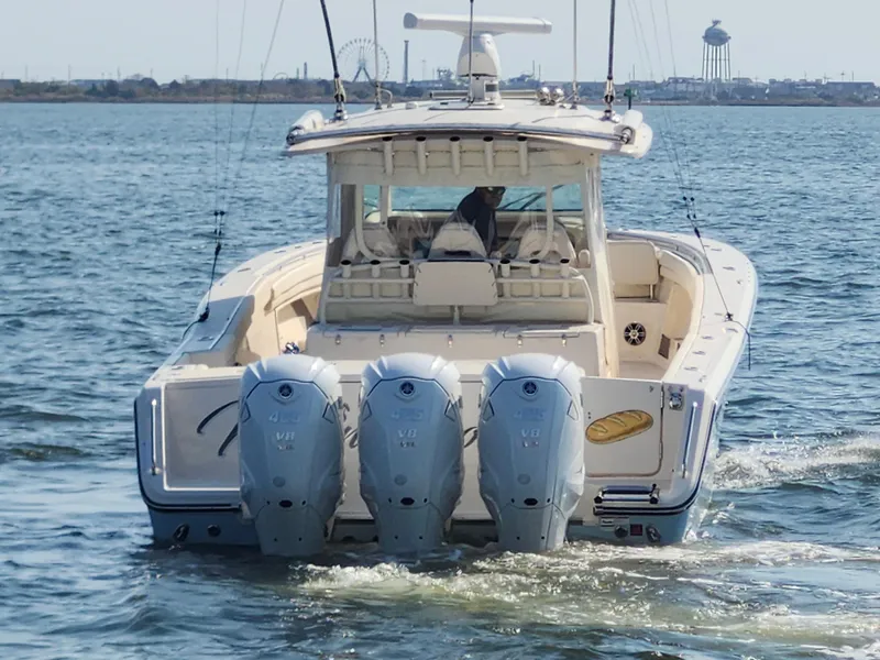 Slide: The Image of 2023 Grady-White Canyon 376 boat cruising on open water. - 8