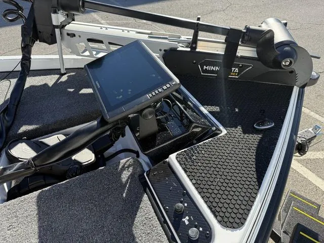 Slide: The Image of Phoenix 721 ZXL 2025 boat dashboard with Minn Kota trolling motor and navigation screen. - 11