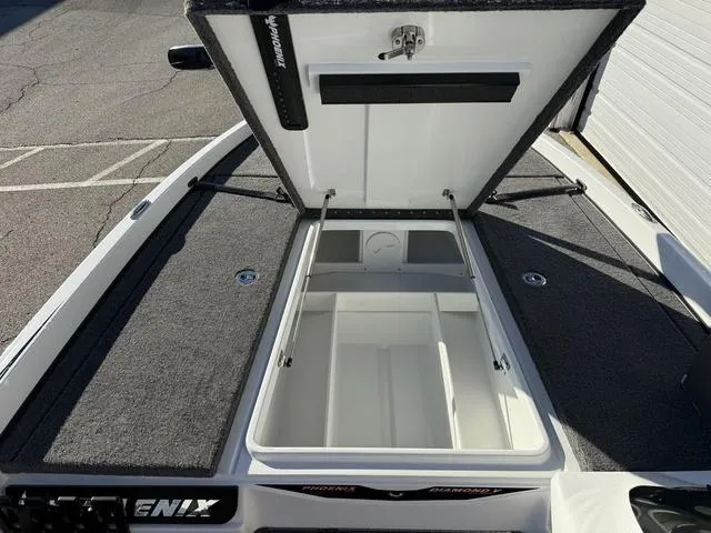 Slide: The Image of 2025 Phoenix 721 ZXL boat storage compartment open, showcasing spacious interior design. - 14