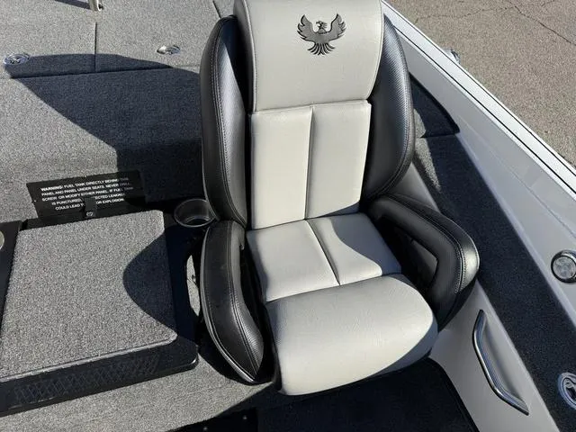 Slide: The Image of 2025 Phoenix 721 ZXL boat seat with logo, featuring sleek black and gray design. - 16