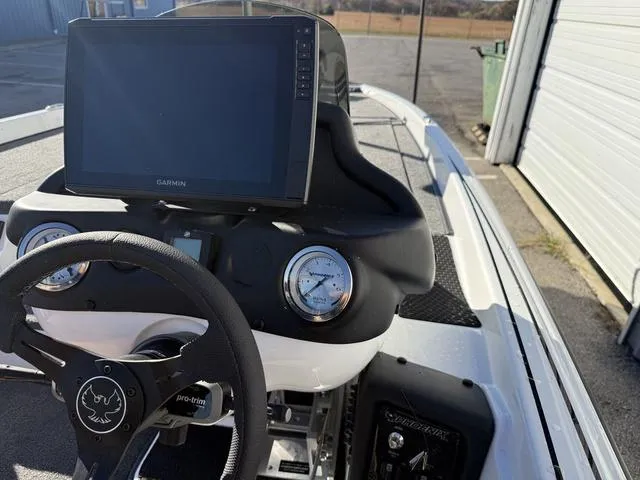 Slide: The Image of Phoenix 721 ZXL 2025 boat dashboard with Garmin display and steering wheel. - 20