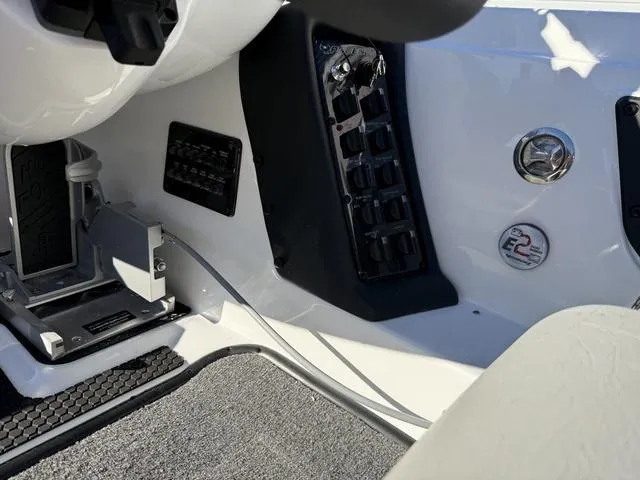 Slide: The Image of Interior view of 2025 Phoenix 721 ZXL boat dashboard with control panel. - 21