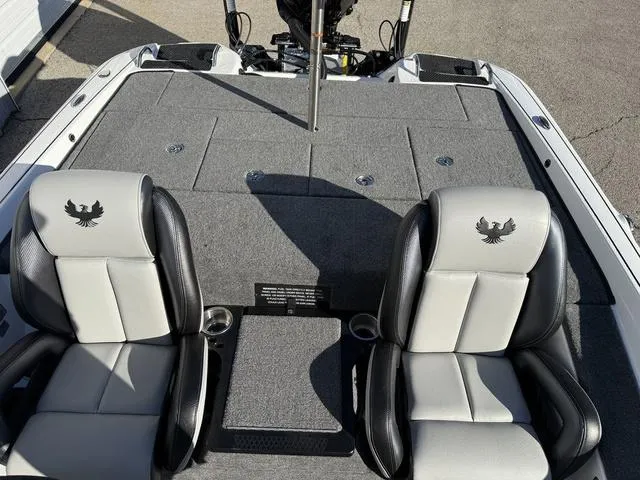 Slide: The Image of 2025 Phoenix 721 ZXL boat interior with two seats and storage compartments. - 22