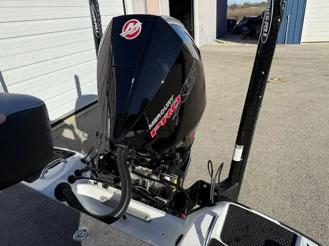 Slide: The Image of 2025 Phoenix 721 ZXL boat with Mercury Pro XS engine in a sunny outdoor setting. - 23