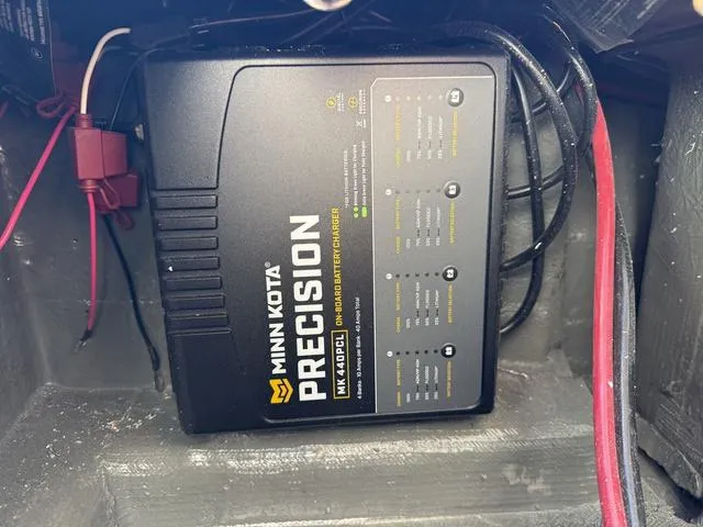 Slide: The Image of Minn Kota Precision onboard battery charger in a 2025 Phoenix 721 ZXL boat. - 24