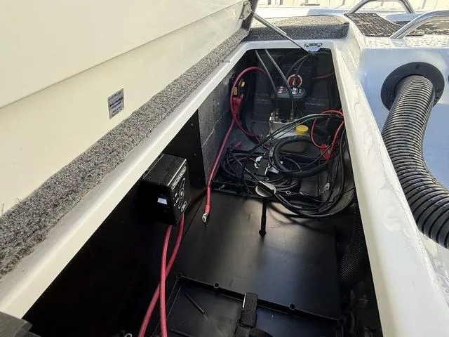 Slide: The Image of 2025 Phoenix 721 ZXL boat interior wiring and battery compartment. - 25