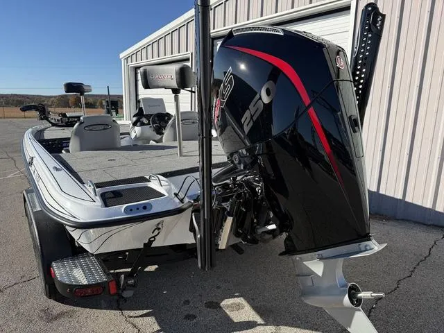 Slide: The Image of 2025 Phoenix 721 ZXL boat with powerful 250 HP engine, parked outdoors. - 4