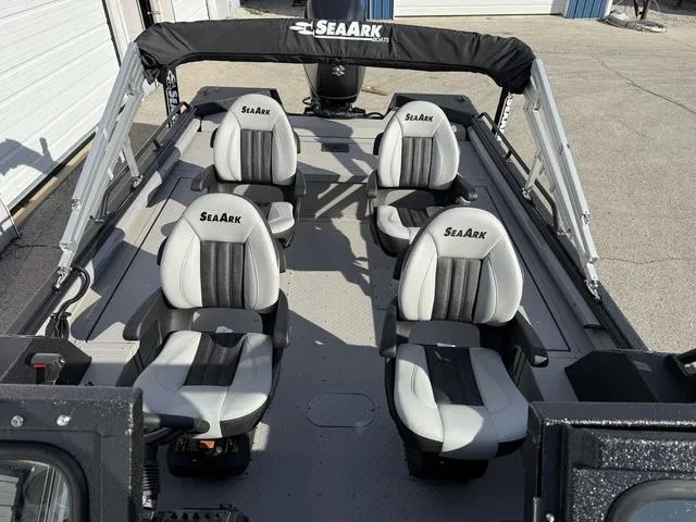Slide: The Image of 2025 SeaArk Pro Cat 240 boat interior with four cushioned seats. - 11