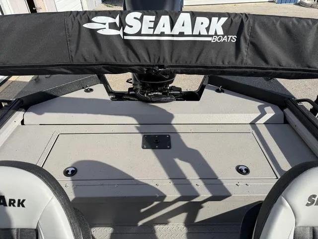 Slide: The Image of 2025 SeaArk Pro Cat 240 boat interior with branded seats and storage area. - 18