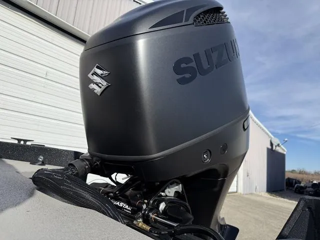 Slide: The Image of Suzuki outboard motor on 2025 SeaArk Pro Cat 240 boat, outdoor setting. - 19