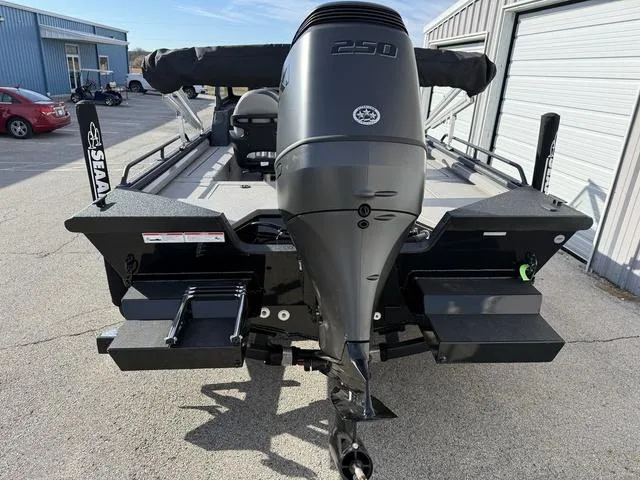 Slide: The Image of 2025 SeaArk Pro Cat 240 boat with powerful 250 engine, parked outdoors. - 3