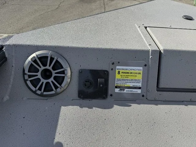 Slide: The Image of SeaArk Pro Cat 240 boat dashboard with speaker and capacity label, 2025 model. - 7