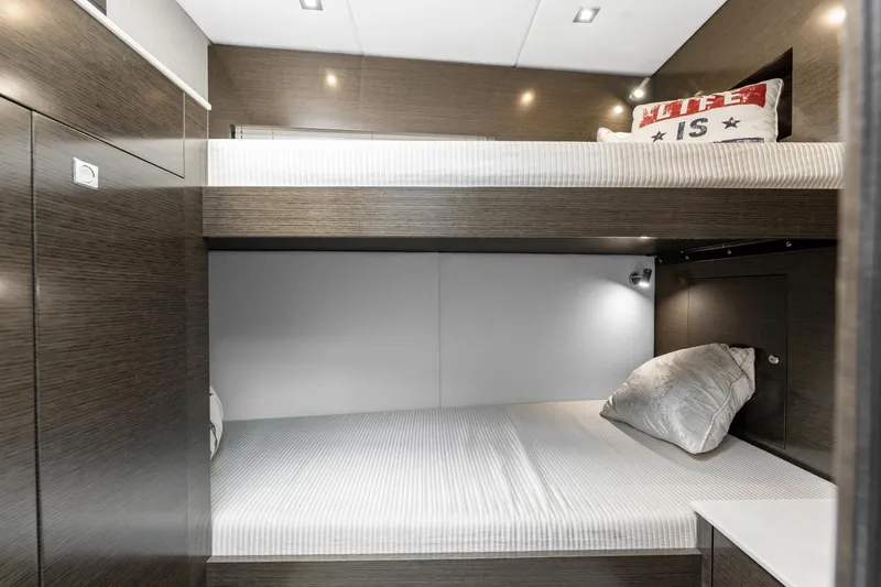 Slide: The Image of 2018 Cruisers Yachts 50 Cantius cabin with bunk beds and modern decor. - 17