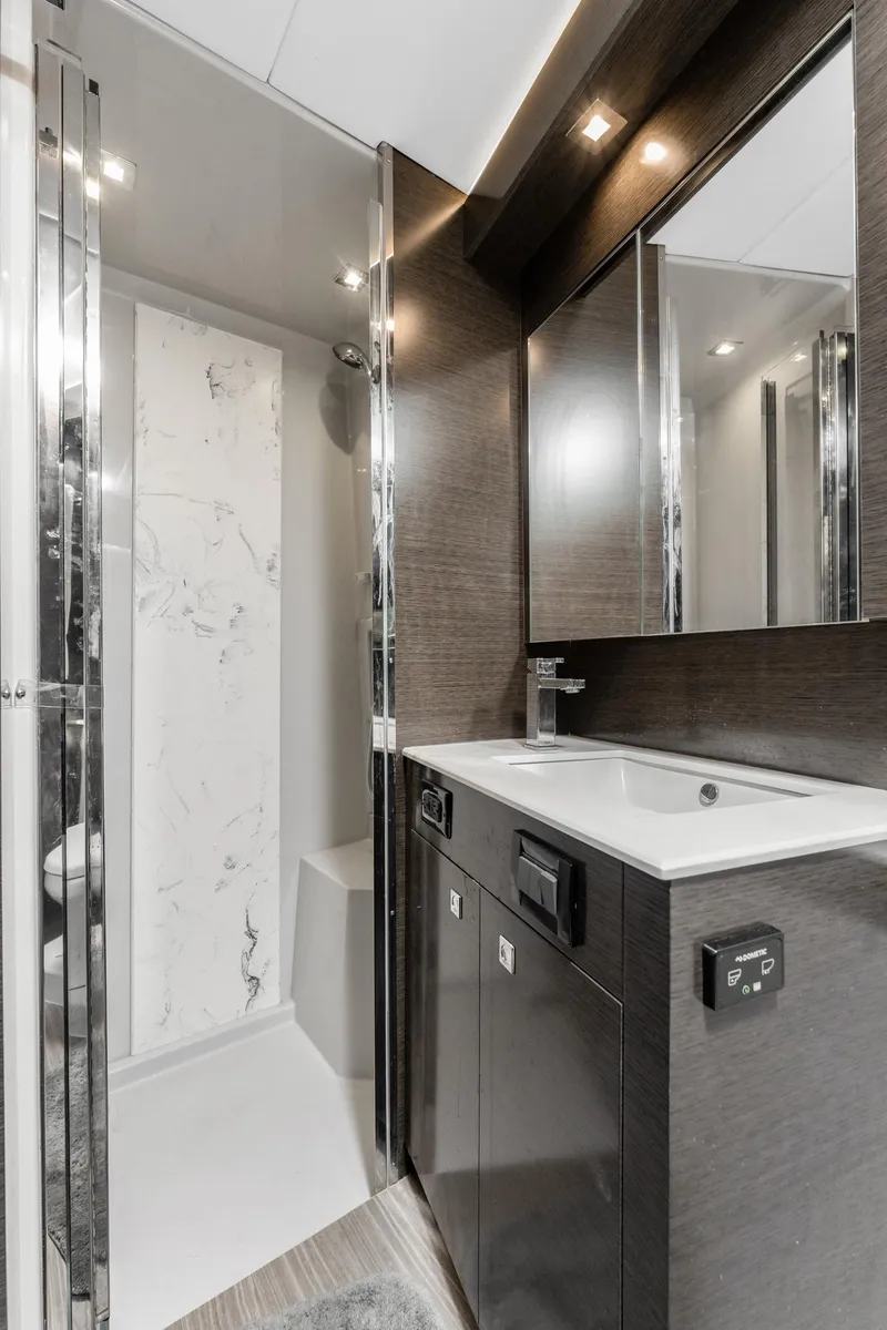 Slide: The Image of Luxurious bathroom in 2018 Cruisers Yachts 50 Cantius with modern fixtures and sleek design. - 21