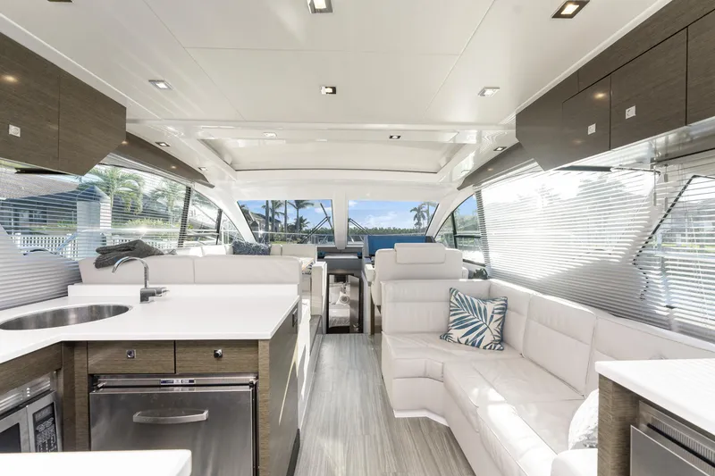 Slide: The Image of Luxurious interior of 2018 Cruisers Yachts 50 Cantius with modern furnishings and panoramic windows. - 32