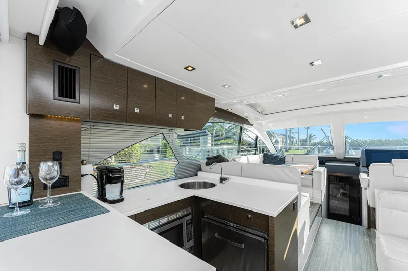 Slide: The Image of Luxurious interior of 2018 Cruisers Yachts 50 Cantius with modern kitchen and seating area. - 47