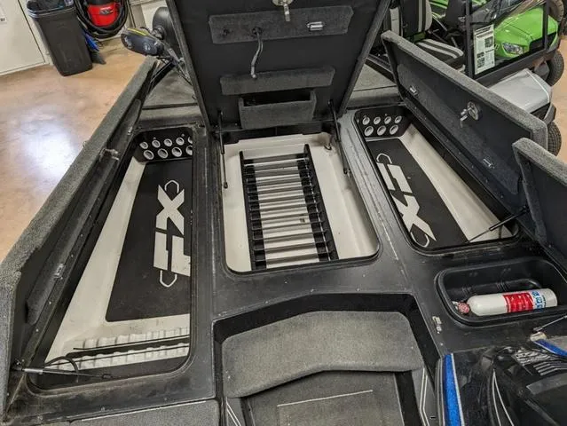 Slide: The Image of 2018 Skeeter FX20 boat interior with storage compartments and safety equipment. - 5
