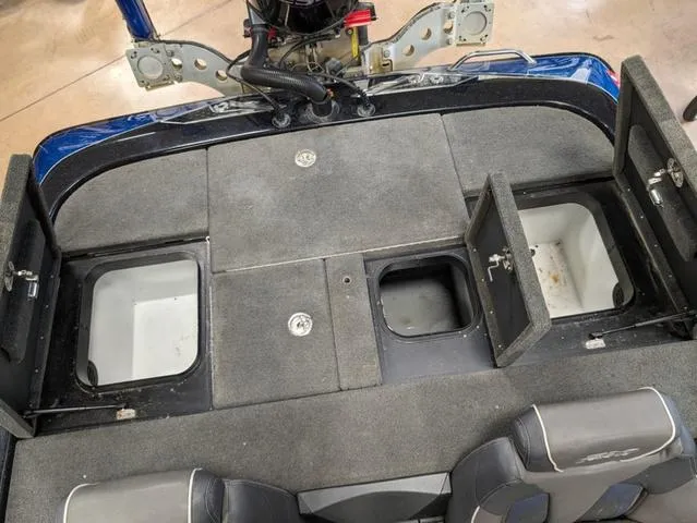 Slide: The Image of 2018 Skeeter FX20 boat storage compartments and seating area. - 6
