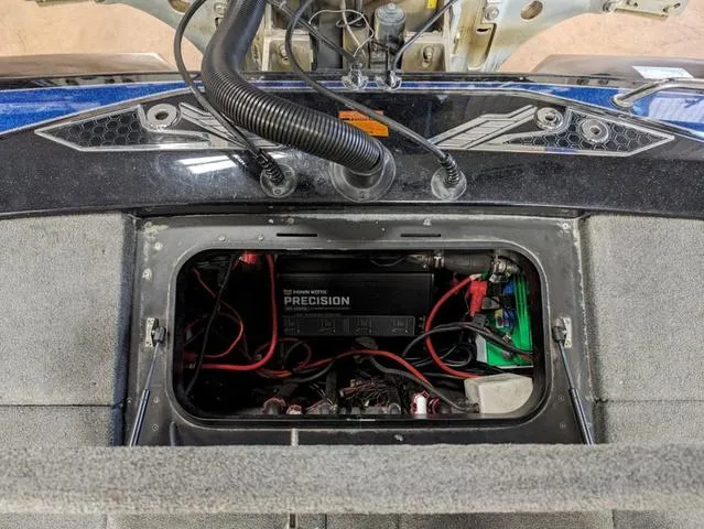 Slide: The Image of 2018 Skeeter FX20 boat battery compartment with wiring and Precision charger. - 7