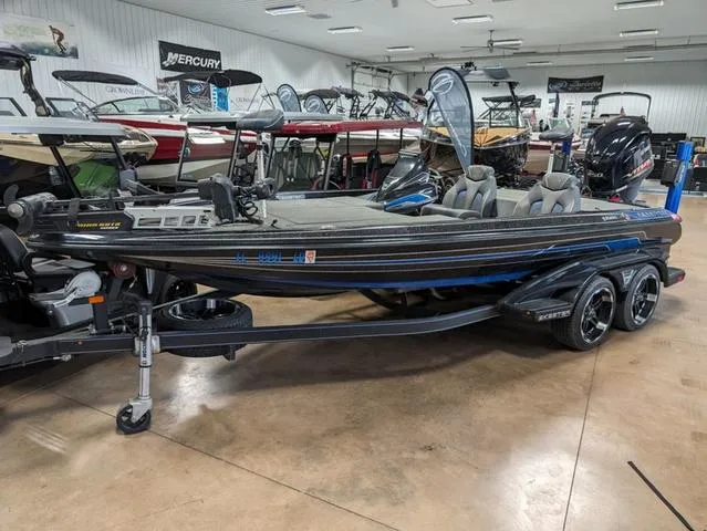 Slide: The Image of 2018 Skeeter FX20 bass boat in showroom, featuring sleek design and dual seats. - 9