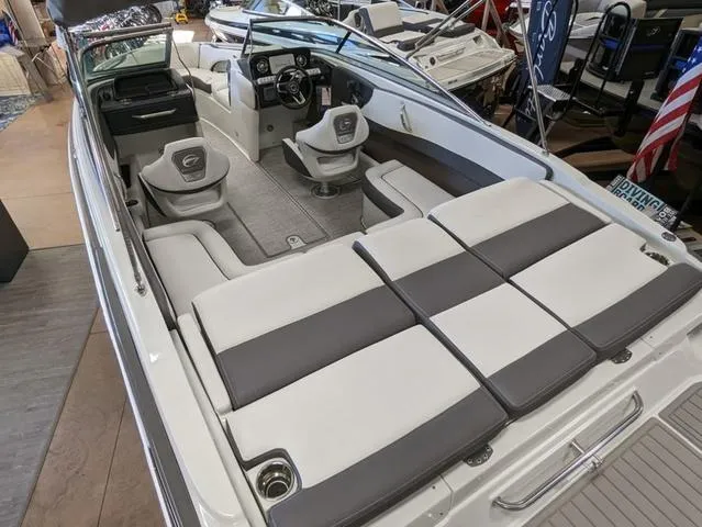 Slide: The Image of 2023 Crownline 240 SS boat interior with spacious seating and modern design. - 5