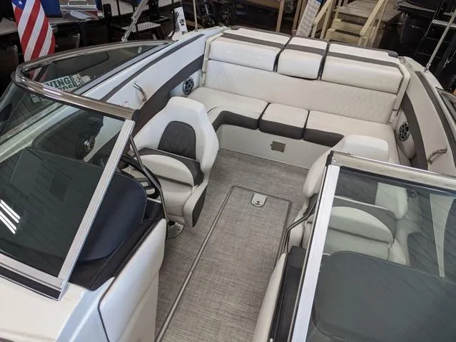 Slide: The Image of 2023 Crownline 240 SS boat interior with plush seating and modern design. - 6