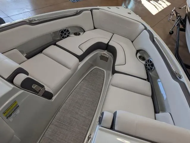 Slide: The Image of 2023 Crownline 240 SS boat interior with plush seating and modern design. - 7
