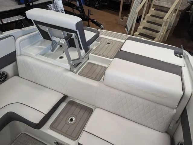 Slide: The Image of 2023 Crownline 240 SS boat interior with white quilted seating and adjustable backrest. - 8