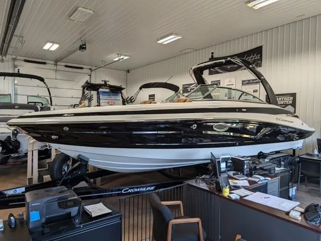 Slide: The Image of 2024 Crownline 290 SS boat displayed indoors on a trailer. - 4