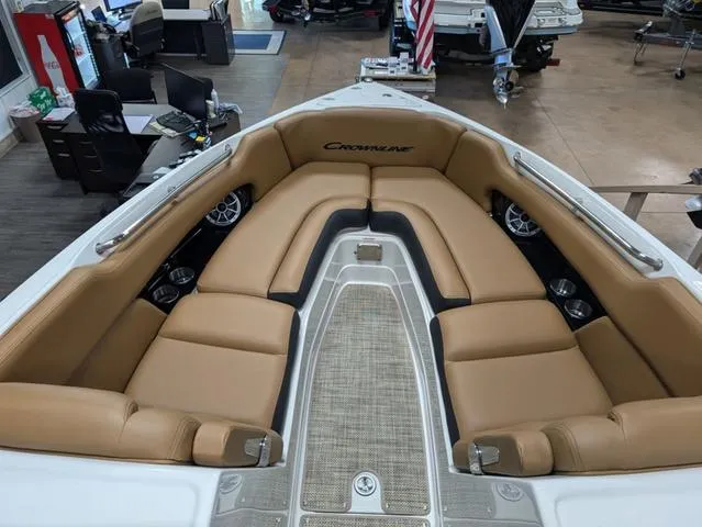 Slide: The Image of 2024 Crownline 290 SS boat interior with tan seating and modern design. - 7