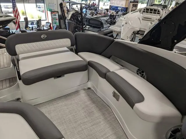 Slide: The Image of 2024 Crownline 280 SS boat interior with gray seating and modern design. - 12