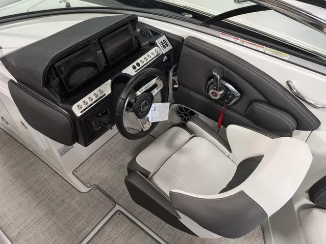 Slide: The Image of 2024 Crownline 280 SS boat cockpit with modern steering and control panel. - 14