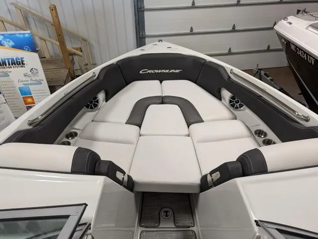 Slide: The Image of 2024 Crownline 280 SS boat interior with plush seating and modern design. - 18
